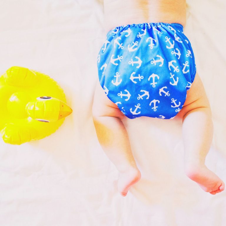 Baby in blue cloth diaper.